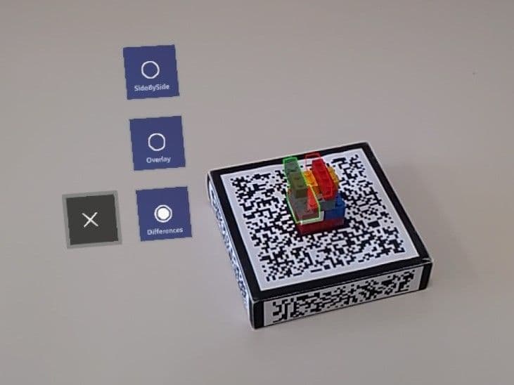 Fiducial marker with LEGO object on top, with virtual highlights augmented.
