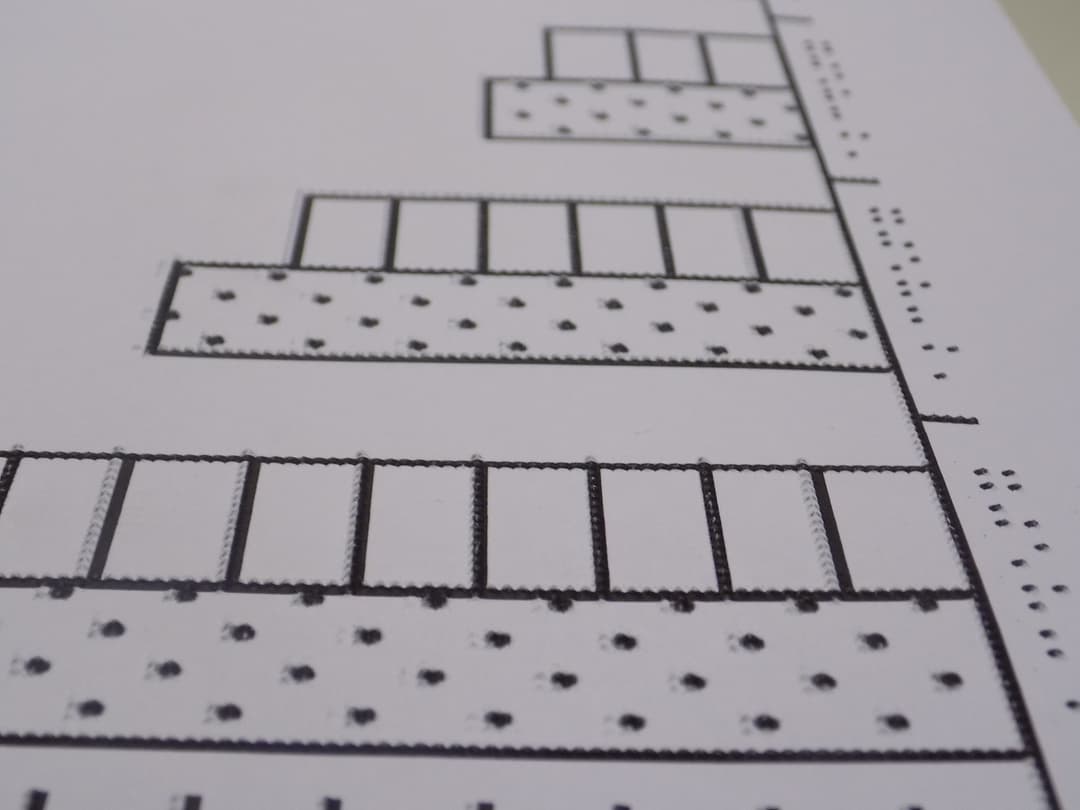 Paper with raised dots that form a bar chart.